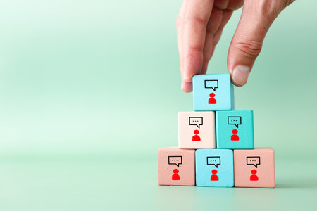 Wooden cubes with figures icons speech bubbles. Concept of communication, information, and...