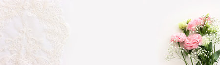 Top view image of pink flowers composition over white backgroundの写真素材