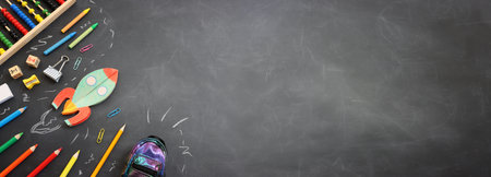 Back to school concept. rocket and pencils over classroom blackboard. Top view