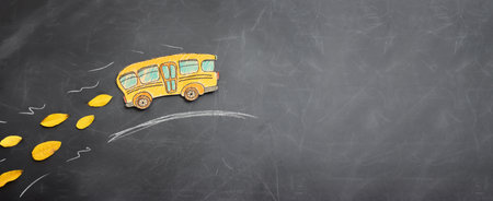 Back to school concept. bus over classroom blackboard. Top viewの写真素材