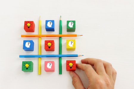 bright light bulb and question mark with pencils concept image ofの写真素材