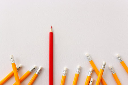 A concept image of different pencils, one is different from the others and stands out from the groupの写真素材