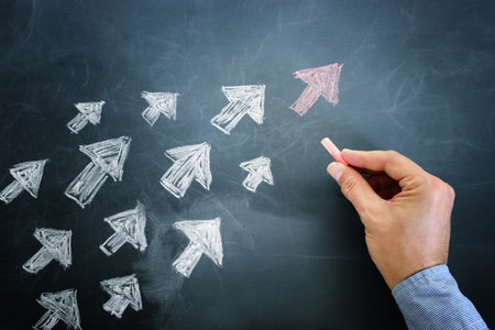 Top view image of chalkboard and arrows. Leadership and teamwork conceptの写真素材