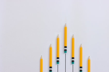 Top view image of pencils on white textured paperの写真素材