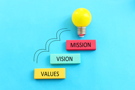 Top view image with wooden cubes with the text vision, mission, valuesの写真素材
