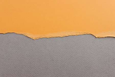 Background of yellow textured torn paperの写真素材