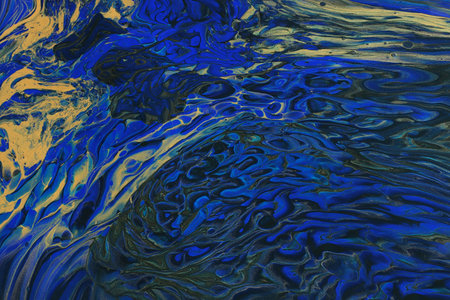 art photography of abstract marbleized effect background with blue and gold creative colors....