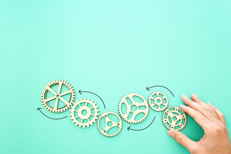 image of spinning gears leading to a growing tree. Concept of creativity, education and technologyの写真素材