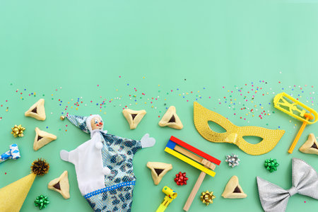 Purim celebration concept (jewish carnival holiday). Hamantaschen cookies over mint backgroundの写真素材