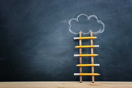 Concept image of ladder made from pencil and chalkboard backgroundの写真素材