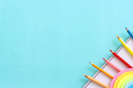 education and back to school concept. stationery over blue background. top view, flat lay