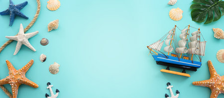 nautical concept seashells and starfish over blue background