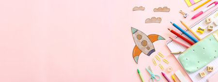 Back to school concept. rocket and pencils over pink background blackboard. Top viewの写真素材