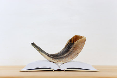 image of shofar (horn) on white prayer talit. Rosh hashanah (jewish New Year holiday), Shabbat and...