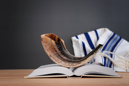 image of shofar (horn) on white prayer talit. Rosh hashanah (jewish New Year holiday), Shabbat and Yom kippur conceptの写真素材