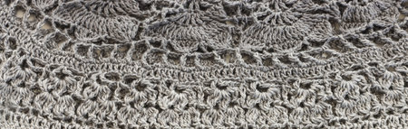 background of gradient gray crochet ornament made of wool