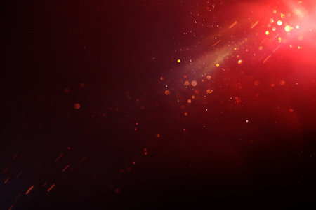 Abstract background of red, black and gold bokeh lights