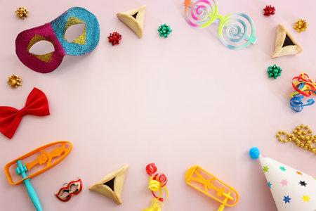 Purim celebration concept (jewish carnival holiday) over pink backgroundの写真素材