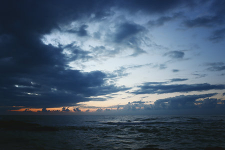 Seascape view and dramatic sky at sunsetの写真素材
