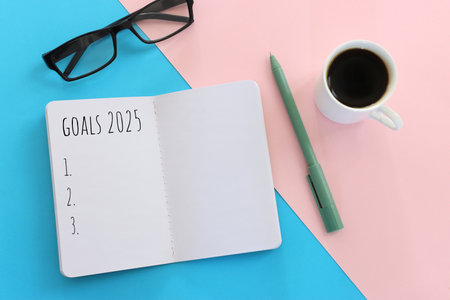 Top view image of notebook with the text goals 2025