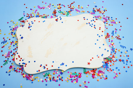 Party colorful confetti over blue background . Top view, flat layの写真素材