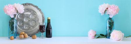 Pesah celebration concept (jewish Passover holiday). Translation of Traditional pesakh plate text: egg, bone, bitter hearb, sweet dateの写真素材