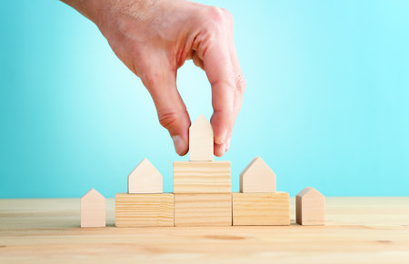 Small houses on wooden steps. Real estate and property value conceptの写真素材