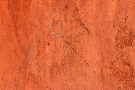 Orange color textured wall background
