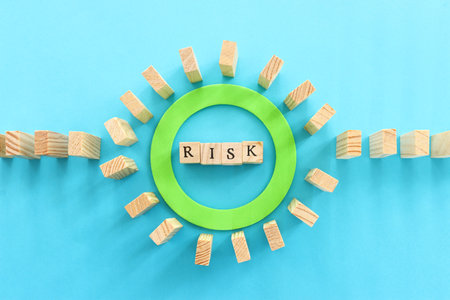 stopping the domino effect. executive and risk control conceptの写真素材