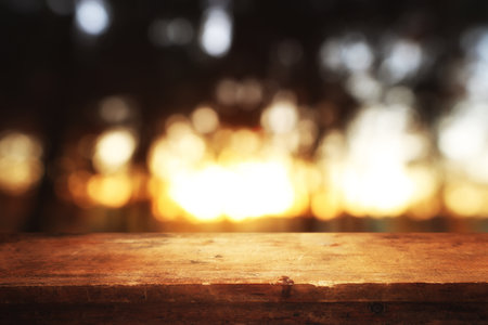 Empty rustic table in front of countryside background. product display and picnic conceptの写真素材