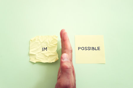 The word impossible is divided into two parts. success and challenge concept.の写真素材