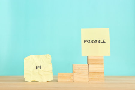 The word impossible is divided into two parts. success and challenge concept.の写真素材