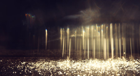 abstract glitter gold and black lights background. de-focusedの写真素材