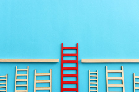 Red ladder stands out of others. Concept of success growth and visionの写真素材