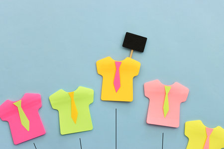 Top view image of colorful sticky notes in the shape of shirtsの写真素材