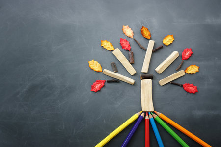 Back to school concept over classroom blackboard. Top view