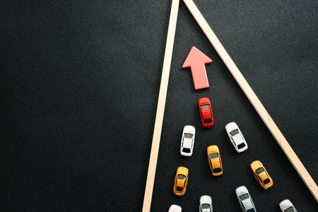 Concept image of cars following the leader. Idea of success and teamworkの写真素材