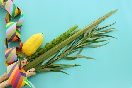 Jewish festival of Sukkot. Traditional symbols (The four species): Etrog (citron), lulav (palm...