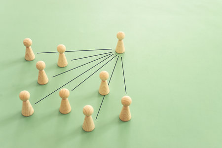 Wooden figures and cubes with connecting lines. Idea of collaboration and teamworkの写真素材