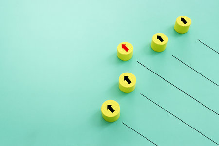 Concept of leadership and forwarding ahead. group of cubes with arrows on blue background