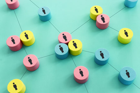 Wooden figures and cubes with connecting lines. Idea of collaboration and teamworkの写真素材