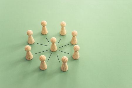 Wooden figures and cubes with connecting lines. Idea of collaboration and teamwork