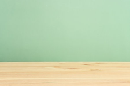 image of wooden table and green pastel background.の写真素材