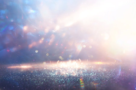 abstract glitter silver and gold lights background. de-focused