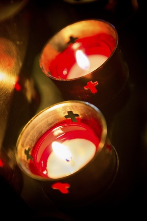 Devotional candles lighting a darkened Basilica of the National Shrine of Mary, Queen of the Universe.の写真素材