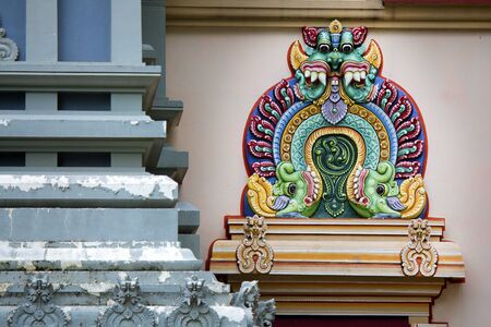 Detail of one of the many colorful decorations adorning the exterior of a Hindu temple.のeditorial素材