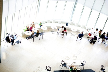 People enjoying the filtered sunlight in the cafe at the Museum of Islamic Art, Doha, Qatar 