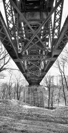 Underside of an old, steel trestle railroad bridge that crosses the Erie Canal at Lockport, New...