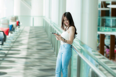 Pretty woman holding tabletの写真素材