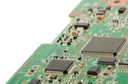 Edge of a laptop motherboard with white background.
